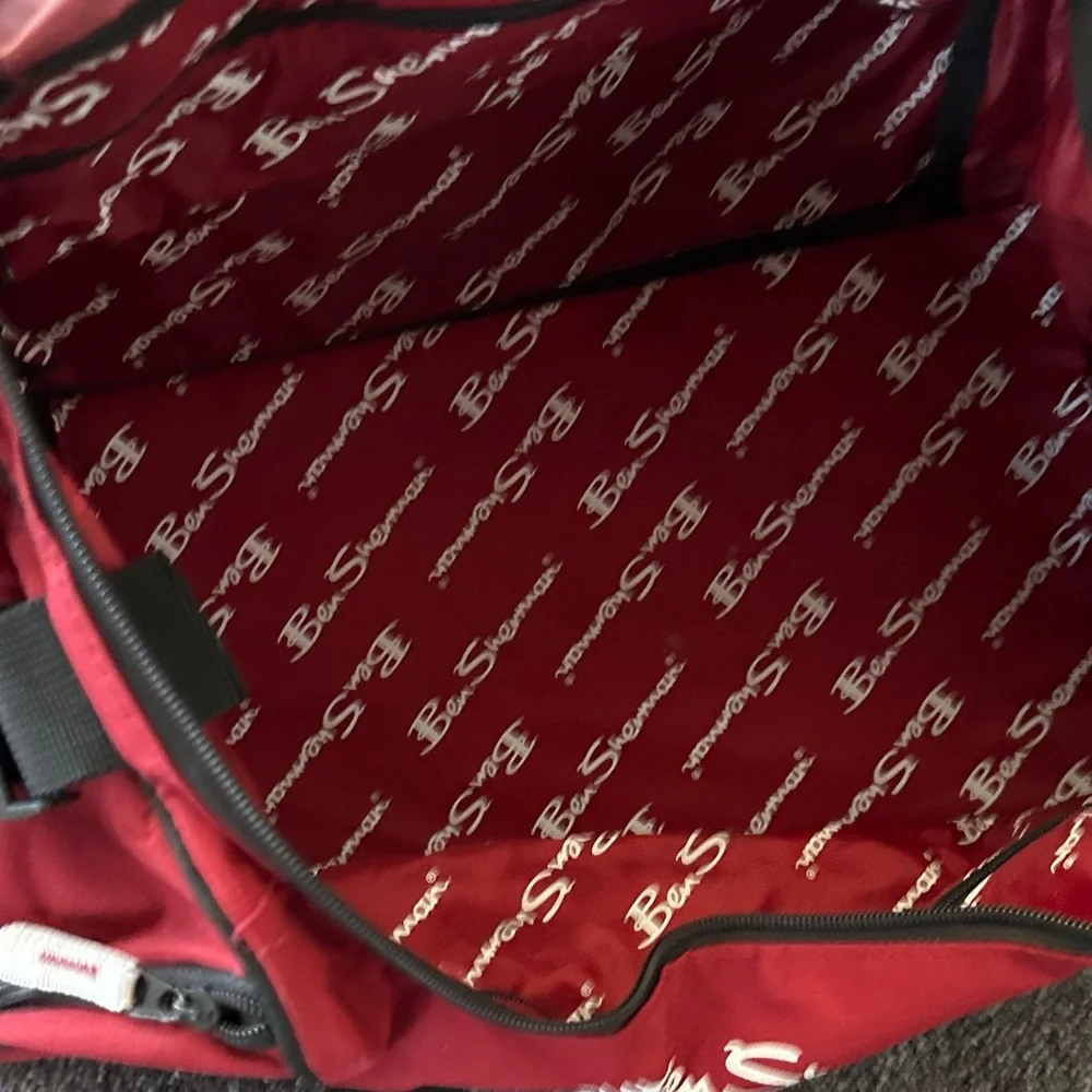 Ben Sherman Burgundy Duffel Bag with Black Accents.